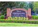 Beautiful brick entrance sign for The Hamptons At Metro West elegant condominium homes at 3291 Westchester Square Blvd # 203, Orlando, FL 32835