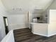 Open concept living space and kitchen area featuring wood floors at 3291 Westchester Square Blvd # 203, Orlando, FL 32835