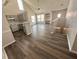 Open concept living space featuring vaulted ceilings and wood floors at 3291 Westchester Square Blvd # 203, Orlando, FL 32835