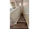 Carpeted staircase leading to the upper level at 3291 Westchester Square Blvd # 203, Orlando, FL 32835