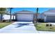 Charming single-Gathering home featuring an attached two-car garage and a well-maintained lawn and landscaping at 3538 Treetop St, Deland, FL 32724