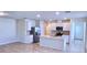Open-concept kitchen featuring an island, stainless steel appliances, and ample cabinet space at 3538 Treetop St, Deland, FL 32724