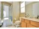 Bright bathroom with a single vanity, toilet, and walk-in shower with a glass door at 3890 Mcguirk Ct, Oviedo, FL 32766