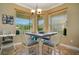 Cozy breakfast nook featuring a dining table with chairs, natural light, and neutral walls at 3890 Mcguirk Ct, Oviedo, FL 32766