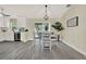 Bright dining area with modern finishes, sliding door and views of the outside at 416 Lancaster Ave, Orange City, FL 32763