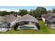 Overhead view of home with a screened-in pool, outdoor furniture, and well-kept lawn at 417 Calabay Parc Blvd, Davenport, FL 33897