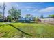 Large grassy backyard, and a view of the exterior of the home at 4192 Gallimore St, Orlando, FL 32811