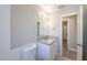 Bathroom featuring granite vanity top, tile flooring, and neutral color scheme at 4192 Gallimore St, Orlando, FL 32811