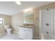 Bathroom with shower and tub combo, granite vanity, and marble tile floor at 4192 Gallimore St, Orlando, FL 32811