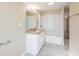 Bathroom features a white vanity with granite countertop and a shower-tub combo at 4192 Gallimore St, Orlando, FL 32811