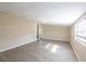 Open room with vinyl flooring, a window and access to another room at 4192 Gallimore St, Orlando, FL 32811
