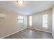 Bright bedroom with three windows letting in natural light, as well as neutral wall color at 4192 Gallimore St, Orlando, FL 32811
