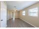 Bedroom featuring modern flooring, fan, and natural light from two windows at 4192 Gallimore St, Orlando, FL 32811