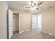 Bedroom featuring modern ceiling fan, light wood flooring, and closet with open door at 4192 Gallimore St, Orlando, FL 32811