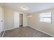 Comfortable bedroom featuring a closet, air conditioner, and window for natural light at 4192 Gallimore St, Orlando, FL 32811