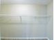 View of empty closet with shelving and light wood flooring at 4192 Gallimore St, Orlando, FL 32811