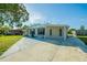 Single-story home with a spacious driveway and well-manicured front lawn at 4192 Gallimore St, Orlando, FL 32811