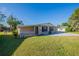 Well-maintained single-story home on a sunny day with a spacious green lawn at 4192 Gallimore St, Orlando, FL 32811