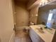 Standard bathroom featuring a shower-tub, vanity, mirror, and toilet at 450 Dewars Ct, Winter Springs, FL 32708