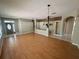 Spacious living room featuring hardwood floors, modern lighting, and open layout at 450 Dewars Ct, Winter Springs, FL 32708