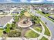 Aerial view of the community playground surrounded by well-maintained landscaping at 493 Talisi Loop, St Cloud, FL 34771