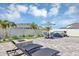 Backyard featuring patio seating, hot tub, and fire pit at 493 Talisi Loop, St Cloud, FL 34771