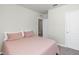 This bedroom includes a closet, door, and window at 493 Talisi Loop, St Cloud, FL 34771