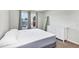 Serene bedroom featuring a white dresser and a large mirror to maximize the natural light at 493 Talisi Loop, St Cloud, FL 34771