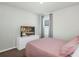 This bedroom features a window with curtains and a television at 493 Talisi Loop, St Cloud, FL 34771