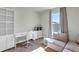 Bedroom features a desk, shelving, seating, and window at 493 Talisi Loop, St Cloud, FL 34771