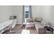 Bedroom features a desk, seating, and window at 493 Talisi Loop, St Cloud, FL 34771