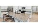 This kitchen has an island with seating and stainless steel appliances at 493 Talisi Loop, St Cloud, FL 34771