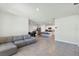 Open concept living area flows into a modern kitchen with stainless steel appliances at 493 Talisi Loop, St Cloud, FL 34771