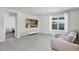 Bright living room with large window, tile flooring, and a comfortable couch at 493 Talisi Loop, St Cloud, FL 34771