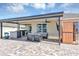 Outdoor patio features a seating area, summer kitchen, television, and sauna at 493 Talisi Loop, St Cloud, FL 34771