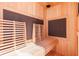 Sauna interior featuring cedar construction, wooden benches, and windows at 493 Talisi Loop, St Cloud, FL 34771