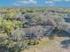 An aerial view of a condo with balconies surrounded by a lush green landscape on a sunny day at 5036 Sherwood Ln # 3945-6, Haines City, FL 33844