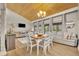 Bright dining room with a wood-burning ceiling, chandelier, and white table and chairs at 5036 Sherwood Ln # 3945-6, Haines City, FL 33844