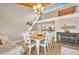 Bright dining room with a wood-burning ceiling, chandelier, and white table and chairs at 5036 Sherwood Ln # 3945-6, Haines City, FL 33844