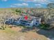 An aerial view of a condo with balconies surrounded by a lush green landscape on a sunny day at 5036 Sherwood Ln # 3945-6, Haines City, FL 33844