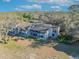 An aerial view of a condo with balconies surrounded by a lush green landscape on a sunny day at 5036 Sherwood Ln # 3945-6, Haines City, FL 33844