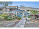 Inviting condo building with well-maintained landscaping and exterior stone accents near the entrance at 5036 Sherwood Ln # 3945-6, Haines City, FL 33844