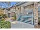 Attractive condo building with stone accents and stairs leading to upper units at 5036 Sherwood Ln # 3945-6, Haines City, FL 33844
