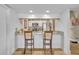 Cozy kitchen with stainless steel appliances and breakfast bar seating two at 5036 Sherwood Ln # 3945-6, Haines City, FL 33844
