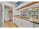 Modern kitchen with white cabinets, granite countertops, and stainless steel refrigerator visible at 5036 Sherwood Ln # 3945-6, Haines City, FL 33844