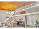 Bright living room featuring a wood-burning ceiling, chandelier, and comfortable seating at 5036 Sherwood Ln # 3945-6, Haines City, FL 33844