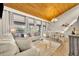 Bright living room and dining room with a wood-burning ceiling, chandelier, and comfortable seating at 5036 Sherwood Ln # 3945-6, Haines City, FL 33844