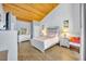 Cozy main bedroom with a wood ceiling and a white framed bed at 5036 Sherwood Ln # 3945-6, Haines City, FL 33844