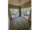 Spacious, screened balcony offers an outdoor retreat with views of surrounding greenery and parking at 5064 Park Central Dr # 1731, Orlando, FL 32839