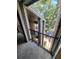View of balcony with black metal railing overlooking the street and other units at 5064 Park Central Dr # 1731, Orlando, FL 32839